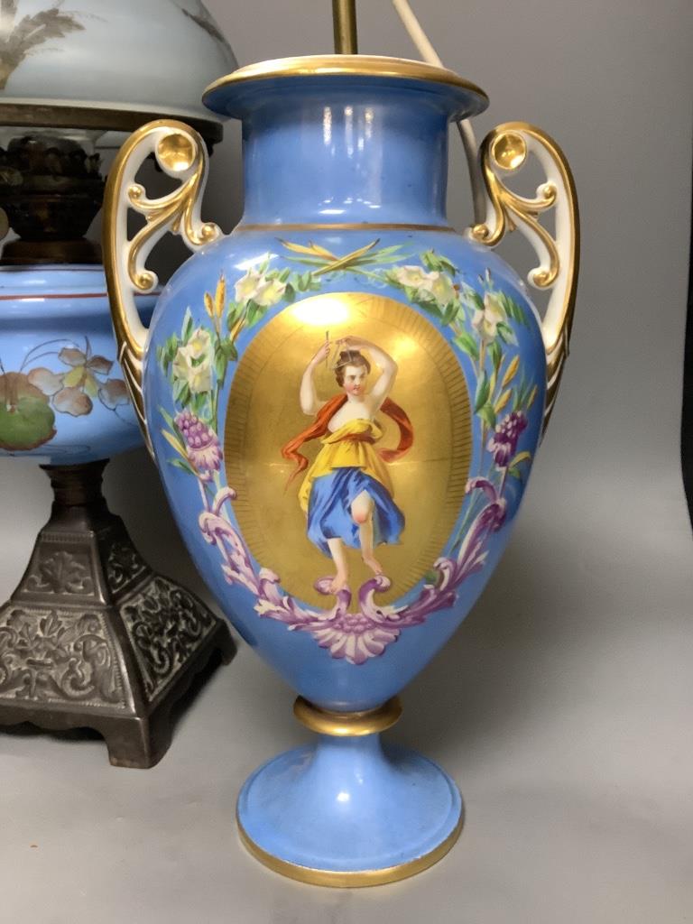 A French porcelain blue ground vase (converted to electricity) and a glass oil lamp